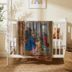 Nativity plush blanket draped over the side of a white crib in a nursery