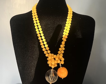 Yellow gold crystal necklace with two large spheres, one clear and one yellow. Long and luminous necklace. A gift full of energy for her.