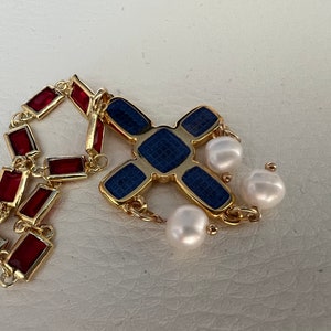 Red crystal glass chain set in 14k gold. Cross-shaped pendant in blue enamel with 3 freshwater pearls. Gift for the bride.