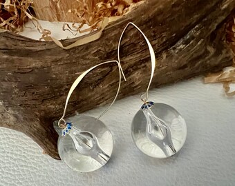 La Boule earrings. Large transparent pearl and large gold-plated hypoallergenic steel hook. Large resin ball with enamel caps.