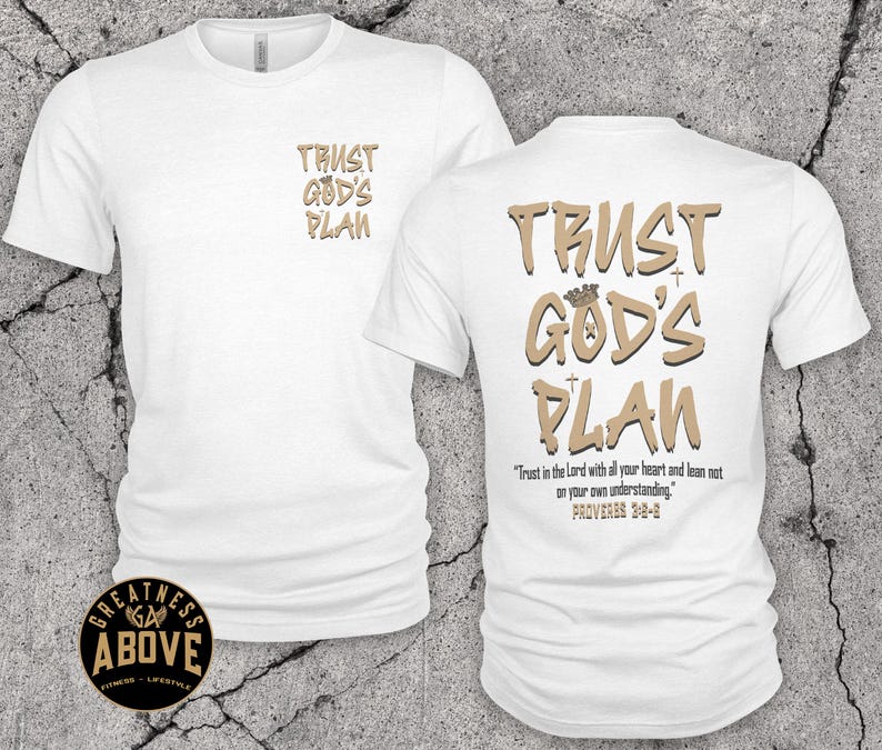 May include: A white short-sleeve t-shirt featuring the text TRUST GOD'S PLAN in tan on the front left chest. The back displays the same text in a larger font with a crown icon, plus the verse Trust in the Lord with all your heart and lean not on your own understanding. PROVERBS 3:5-6.