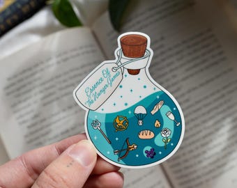 May include: A sticker featuring a potion bottle design with a cork stopper. The bottle contains a teal liquid and various illustrations, including a trident, bow and arrow, and a parachute. The tag reads "Essence Of The Hunger Games".