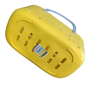 May include: A yellow plastic pet carrier with a blue handle. The carrier has multiple ventilation holes and a label that reads "YOUNG-3". The carrier is designed for transporting small animals.