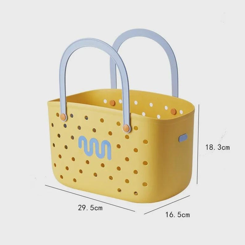 May include: Yellow perforated tote bag with light blue handles. The bag has a blue wave-like design and orange accents. Dimensions are 29.5 cm long, 16.5 cm wide, and 18.3 cm high.