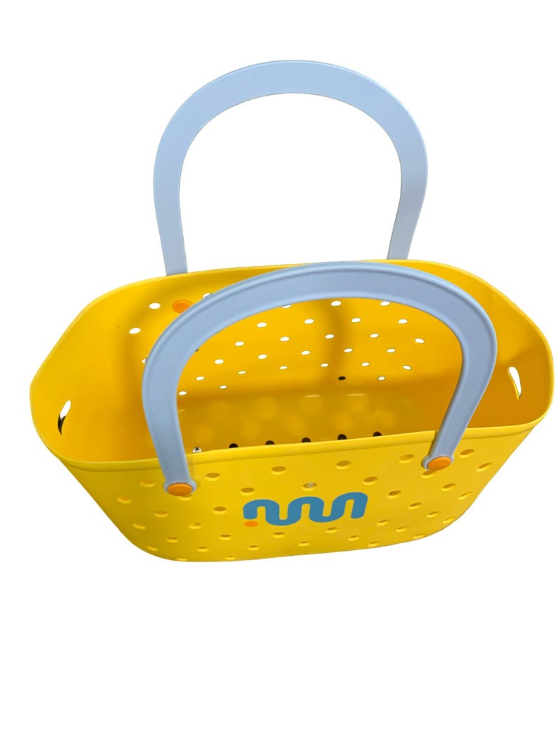 May include: A bright yellow tote bag with a light blue handle. The bag has a perforated design and a blue and yellow graphic on the side. The handles are light blue with orange accents. The bag is designed for carrying items.