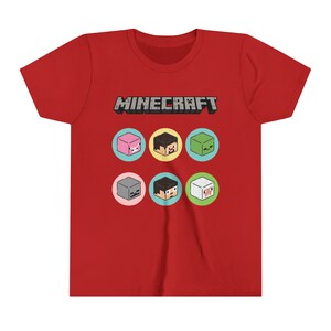 May include: Red short-sleeved t-shirt featuring the word "MINECRAFT" in grey lettering and a graphic of six Minecraft characters in colourful squares.