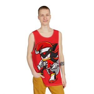 May include: A red tank top featuring a cartoon image of Shadow the Hedgehog wearing a Santa hat. The character is in a fighting pose and has a red and white Santa suit.