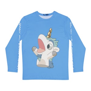 May include: A light blue long-sleeved t-shirt featuring a white unicorn graphic on the front. The unicorn has a blue mane and tail, and is holding its arms up in the air. The text "You Will Never Escape" is printed on the sleeves in white.