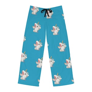 May include: Blue pyjama pants with a white unicorn pattern. The unicorn is wearing a party hat and has its mouth open.