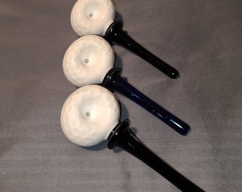 Golf Ball on Tee glass pipe.