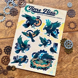 May include: A sheet of stickers featuring dark teal raven illustrations with clock and gear accents. The stickers are labeled "Time Flies" and "Nisnow's Steamworks Family". Decorative metal gears surround the sticker sheet.