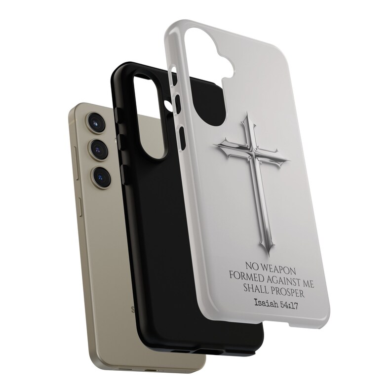 May include: White phone case with a silver cross and the text "No weapon formed against me shall prosper Isaiah 54:17"