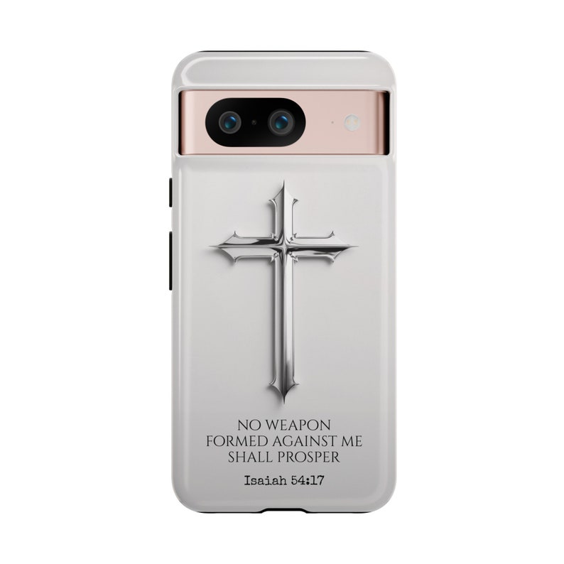 May include: White phone case with a silver cross and the text "NO WEAPON FORMED AGAINST ME SHALL PROSPER Isaiah 54:17"