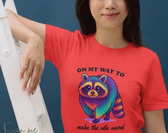 On My Way to Make the Vibe Weird – Colorful Raccoon T-Shirt for Bold Personalities