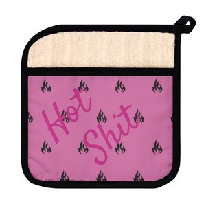 May include: Pink hot pad with black flames and the text "Hot Shit" in pink.