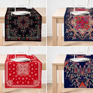 May include: Four table runners with different patterns. The first runner is black with a colourful mandala design. The second runner is navy blue with a pink and red floral design. The third runner is red with a white bandana pattern. The fourth runner is navy blue with a colourful floral design.