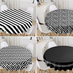 May include: Four different round tablecloths with black and white patterns. The tablecloths are shown on round tables with white chairs. The tablecloths are numbered 1 through 4.