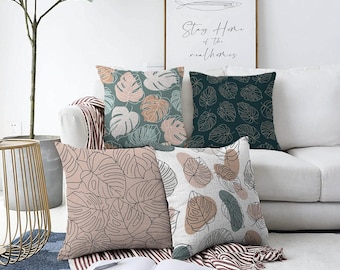 Funda de cojín con diseño de hojas tropicales: estampado de monstera en colores pastel