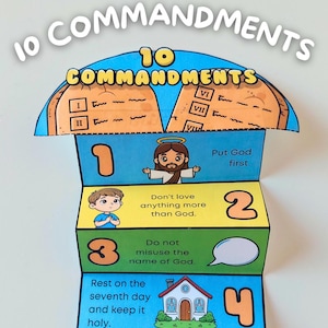 May include: A colourful, layered paper craft titled "10 Commandments." The top layer features the title and illustrations of the Ten Commandments. The layers below display numbered commandments with accompanying illustrations and text, including a house and cartoon figures.