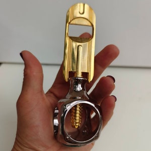 bottle opener and nutcracker heavy stainless steel and golden plated 24 kt "Olimpic" by DOM BREV. Made in Italy