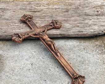 Old brass wall cross of Jesus