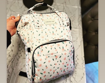 Bolso cambiador de viaje impermeable con estampado floral