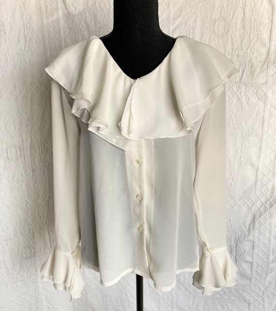 Elegant ivory long-sleeved blouse with soft roman… - image 1