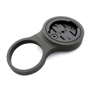 May include: Black bike mount with a circular base and a loop on the side. The base has a circular cutout with the text "Garmin" and "Fit" printed on it.