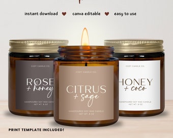 May include: Three amber glass candle jars with gold lids and labels. The labels are white with brown text and feature different scents: Rose + Honey, Citrus + Sage, and Honey + Coco. Each label says "Handpoured Soy Wax Candle" and "Net Wt. 8 oz".