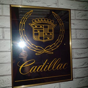 Cadillac logo, full mirror style, gold.