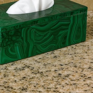Decorative malachite tissue holder with swirling emerald green mineral design