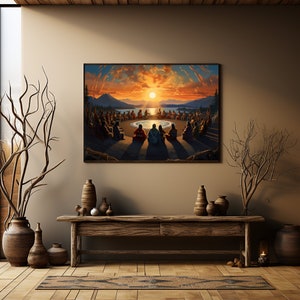 May include: A painting depicting a group of people sitting in a circle around a fire, with a sunset in the background. The people are wearing traditional clothing and have their hands clasped together. The painting is framed and hanging on a wall.