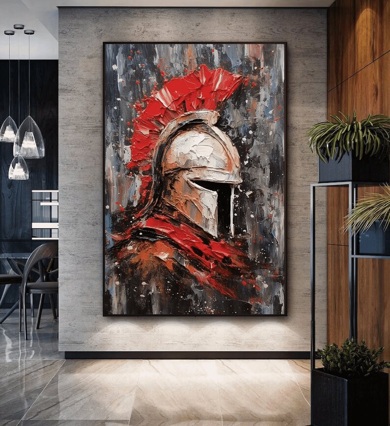 May include: A painting of a warrior's helmet with a red plume. The helmet is painted in a white and brown color scheme, with a black visor. The background is a dark gray with splashes of red and white paint.