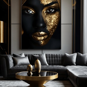 May include: An abstract portrait of a woman's face in black and gold with glitter makeup. The portrait is framed and hanging on a wall in a modern living room.