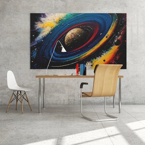 May include: A modern home office with a desk and two chairs. A large abstract painting of a galaxy with a planet in the center hangs on the wall. The painting is in shades of blue, yellow, red, and black.