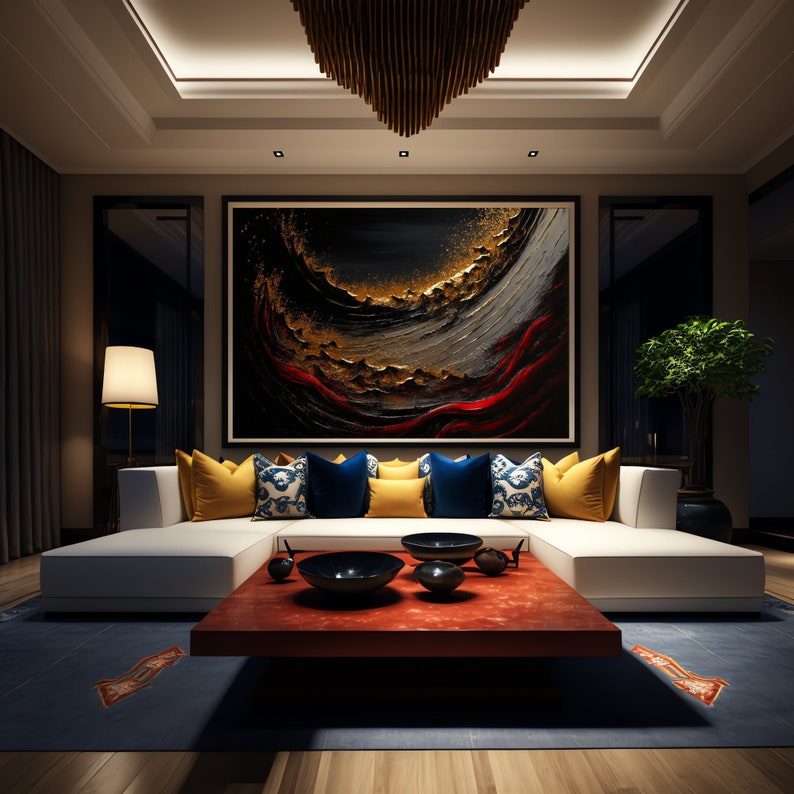 May include: A white sectional sofa with yellow, blue, and patterned pillows sits in a modern living room. A large abstract painting with gold, red, and black colors hangs on the wall above the sofa. A wooden coffee table with a red top sits in front of the sofa.
