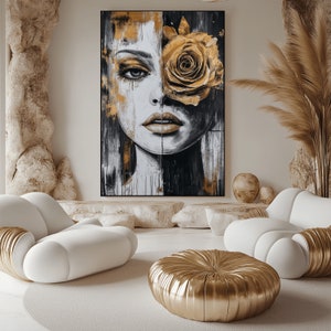 May include: Abstract painting of a woman's face with a large golden rose covering one eye. The background is a mix of black, white, and gold paint.
