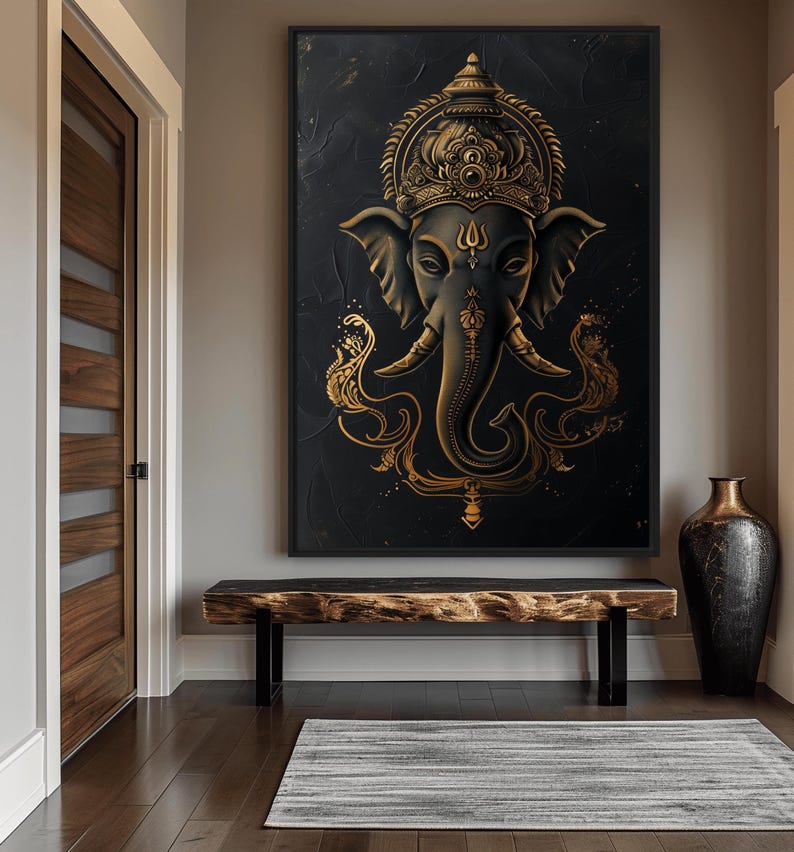 May include: A gold and black framed canvas print of a Hindu deity, Ganesha, with an intricate design. The deity is depicted with an elephant head and a crown.
