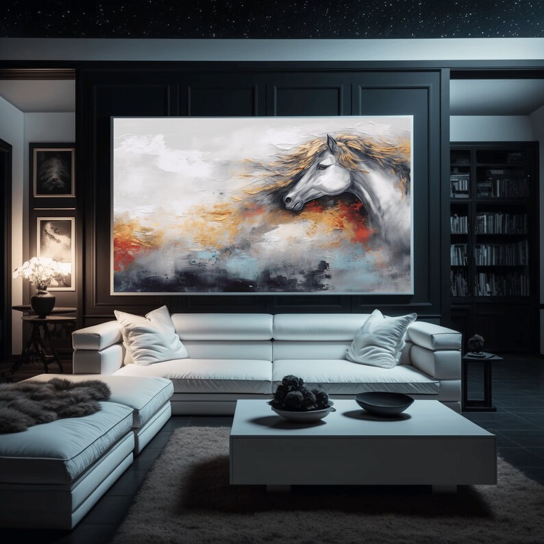 May include: Abstract painting of a white horse with a flowing mane against a background of gold, blue, and white paint. The painting is framed and hanging on a black wall in a living room.