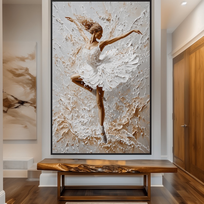 May include: A white ballerina in a white tutu is dancing in a swirl of white and gold paint. The painting is framed in black.
