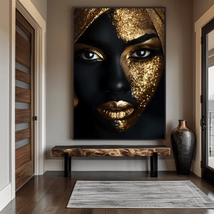 May include: A close-up of a woman's face with gold glitter makeup. The background is black and the image is framed.