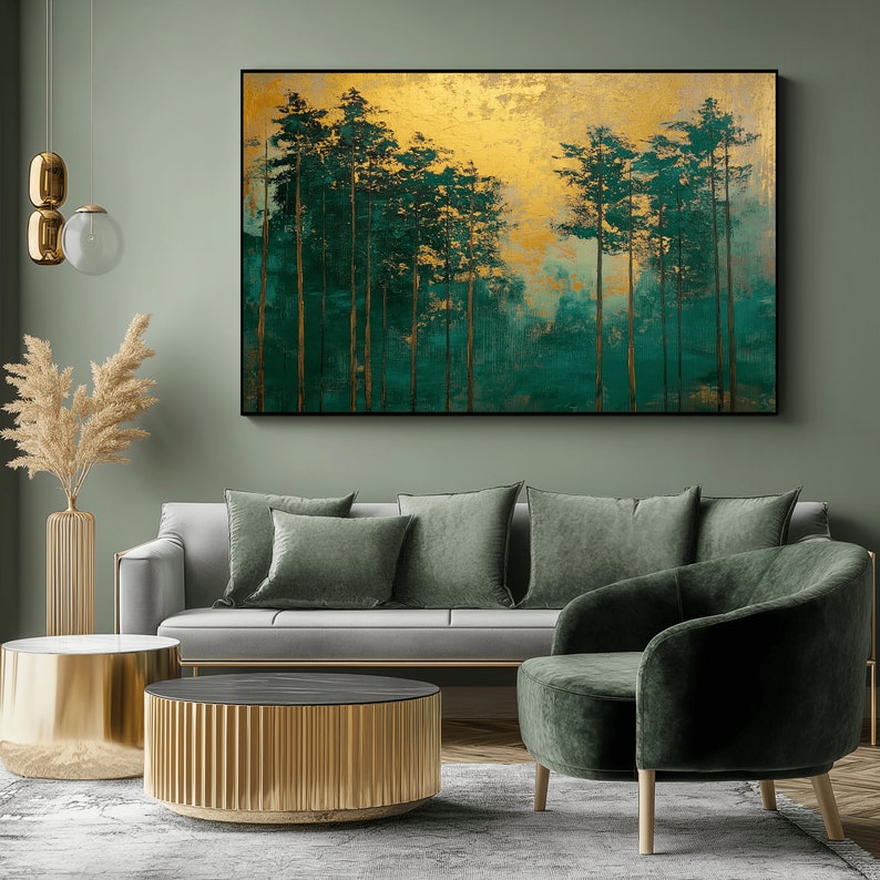 May include: An abstract painting of a forest scene with tall, slender trees in shades of green and gold. The artwork is framed in black and hangs above a gray sofa with green pillows and a matching armchair. A gold coffee table and decorative vase complete the room.