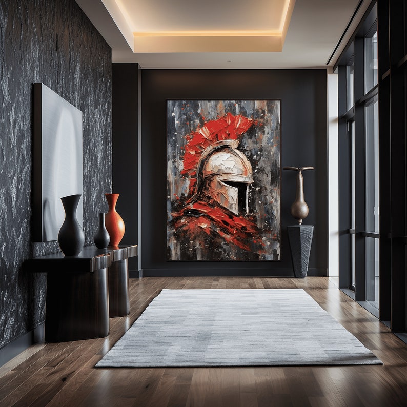 May include: A large abstract painting of a warrior's helmet in red, white, and gray tones. The helmet is set against a dark gray background with white and red splatters of paint. The painting is displayed in a modern hallway with a dark gray wall and a white rug.