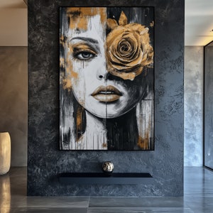 May include: A black and white abstract painting of a woman's face with a large yellow rose covering one eye. The background is a textured black surface.