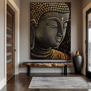 May include: A large black and gold Buddha portrait hangs on a gray wall above a wooden bench. The artwork features a detailed depiction of Buddha's face with gold accents. A tall, dark vase sits to the right, and a striped rug lies on the wooden floor.