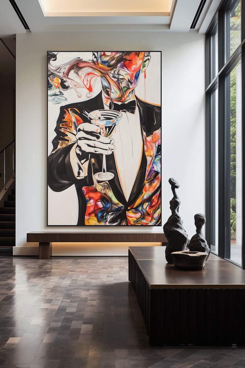 May include: A colorful abstract painting of a person in a tuxedo holding a martini glass. The painting is set against a white background and features a variety of colors, including red, blue, green, and yellow.
