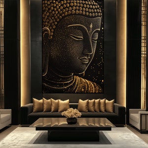 May include: A large, black and gold Buddha wall art print. The Buddha's face is in profile, with closed eyes and intricate gold detailing. The artwork is displayed above a dark gray sofa with gold pillows, a black coffee table, and a light gray rug.
