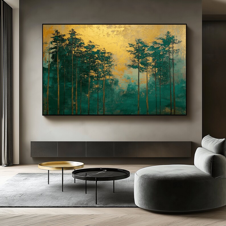 May include: Large rectangular wall art featuring a forest scene. The artwork has a gold background with green and teal trees. The trees have gold trunks and green foliage. The artwork is framed in a black frame.
