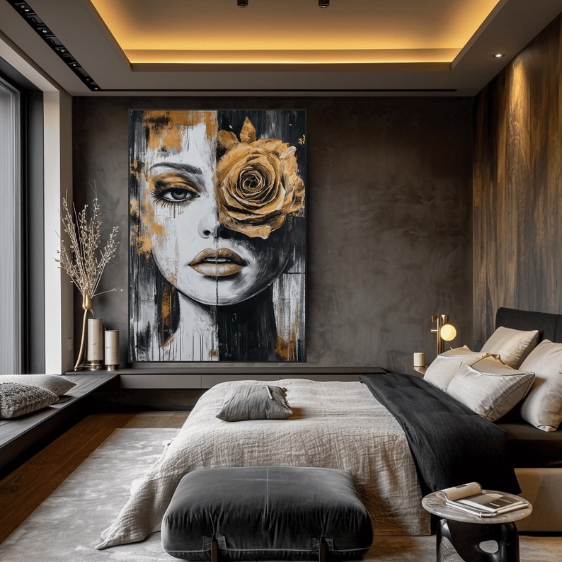May include: A black and white portrait of a woman with a large golden rose covering her right eye. The painting is set against a dark brown background and is displayed in a modern bedroom setting.
