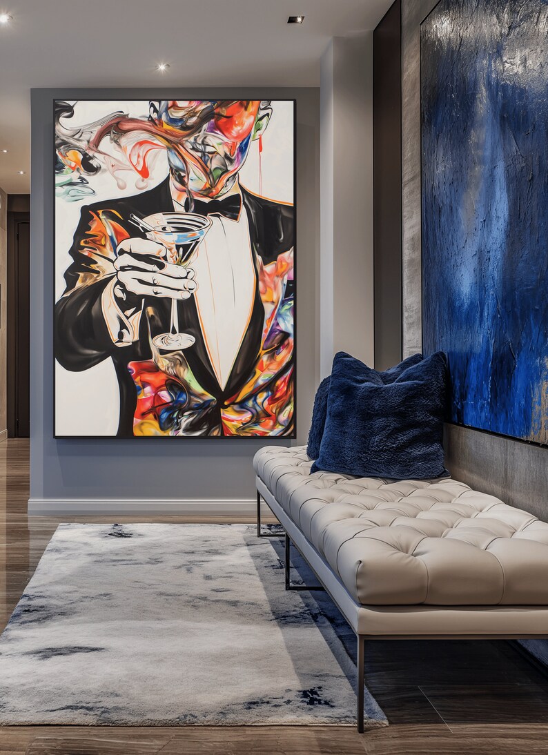 May include: A hallway with a white rug, a white leather bench with blue pillows, and a large framed painting of a man in a tuxedo holding a martini glass. The painting is colorful and abstract.